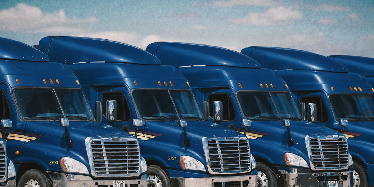 Fleet of semi trucks - parked in the daytime